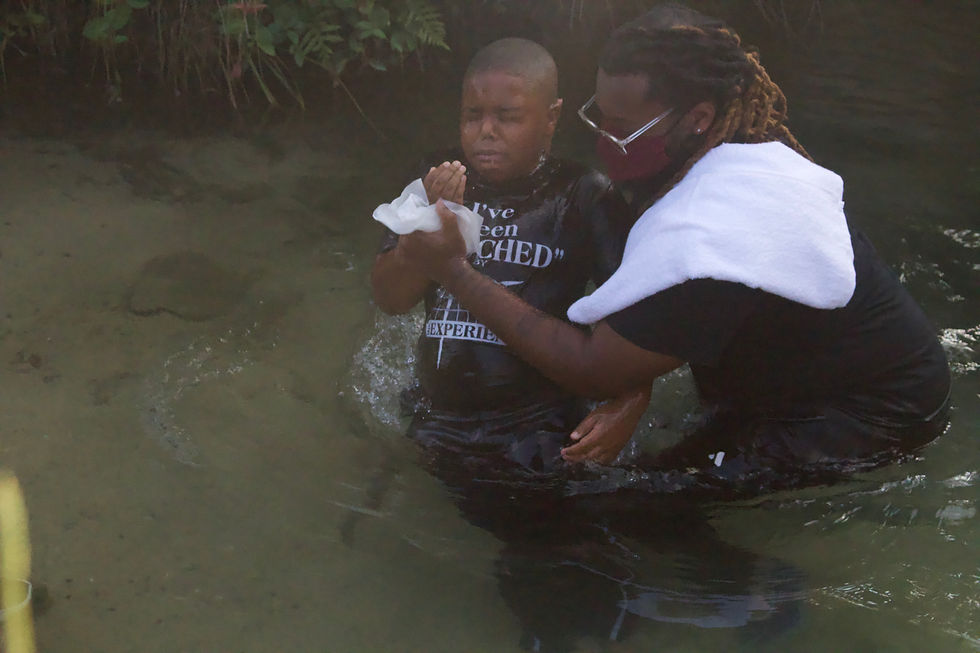 Brandon C. Jackson baptizing Mycah Horstead