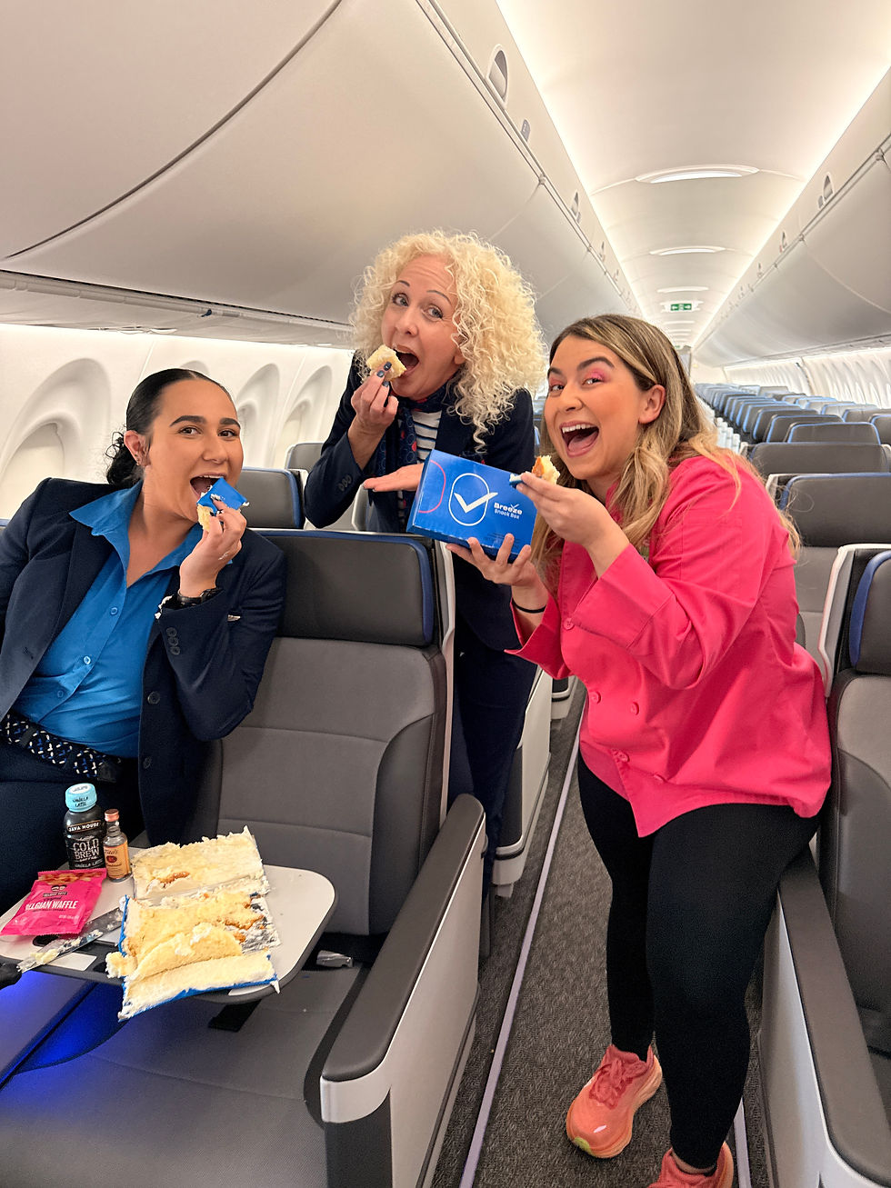 Kristina Lavallee with Breeze Airways Flight attendants on Breeze Airways Airbus A220-300