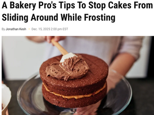 Kristina Lavallee stacking and frosting cake layers using professional stabilization techniques.