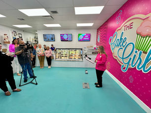 Kristina Lavallee standing next to Telemundo 49 anchors on-camera during an homage for her dessert artistry and cultural impact.