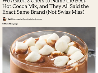 Kristina Lavallee preparing a rich cup of hot cocoa in a professional bakery kitchen, featured as a baking expert in The Kitchn.