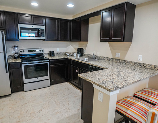 Full kitchen in a Vacation Village at Parkway suite