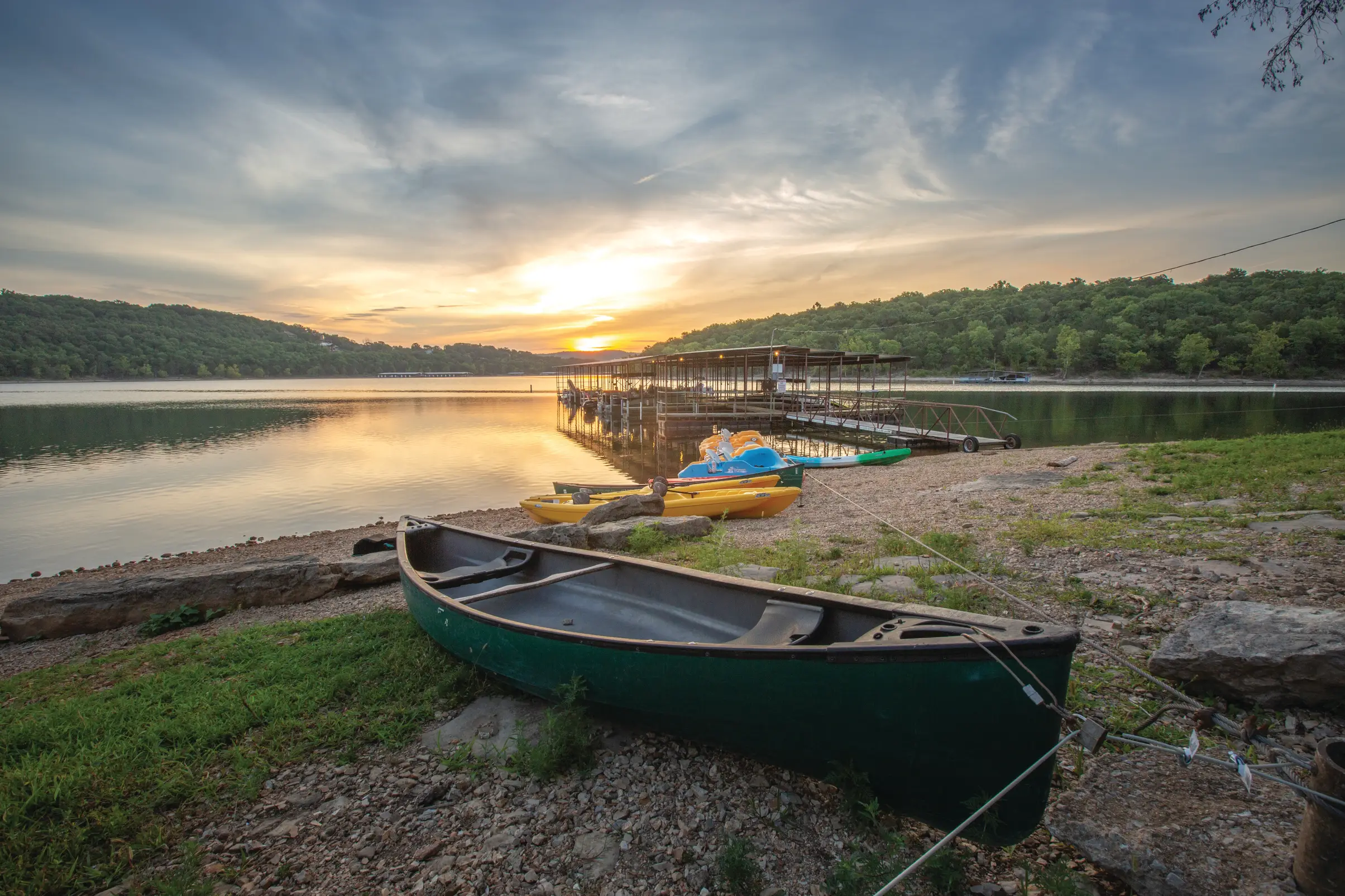 Canoe on the lake at a Holiday Inn Club Vacations resort at sunset