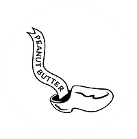 Words from a wooden shoe with peanut butter written on a paper ribbon coming out of the authentic Dutch klog.