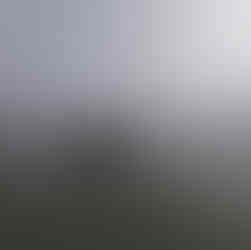 Kate lying on a surfboard