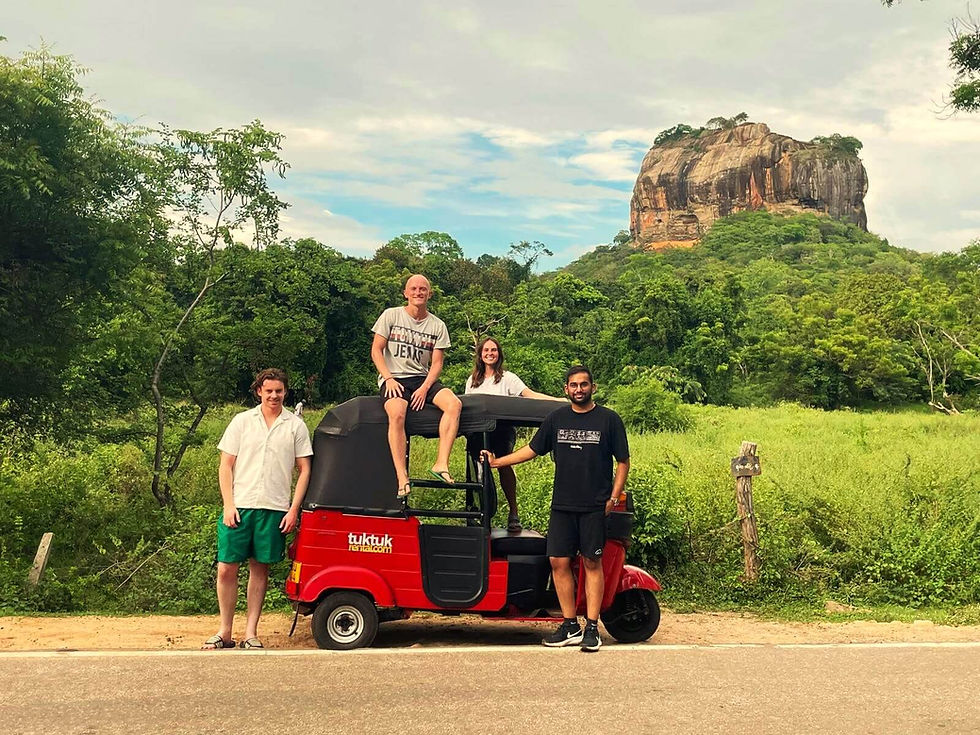 Tuktuk parked in front of Sigiriya Rock