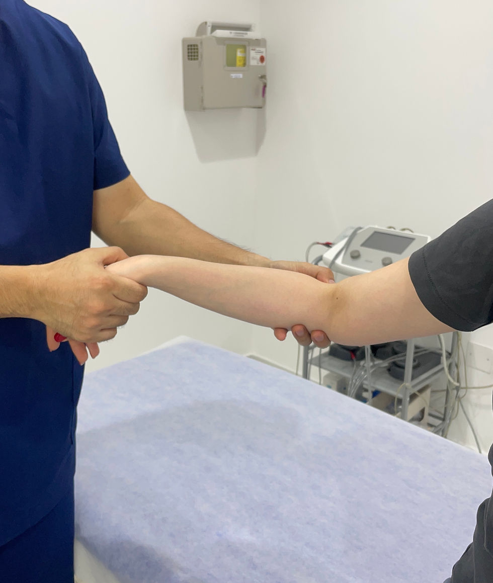 Eye-level view of a physiotherapist guiding a patient through arm exercises