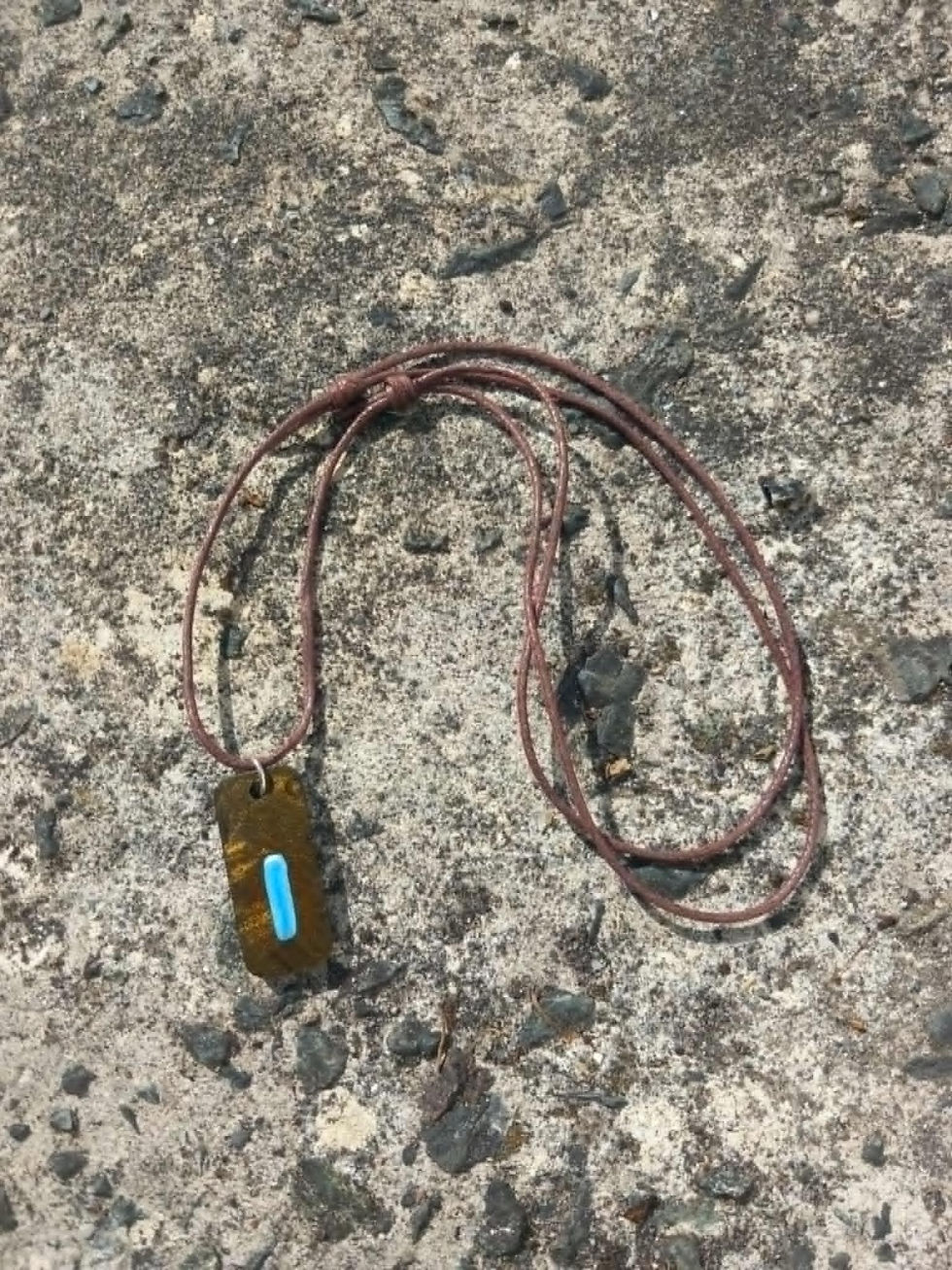 Thumbnail: Pinhoti Trail blue blaze resin pendant on rocks
