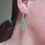 Thumbnail: Green appalachain trail dangle earrings worn by model