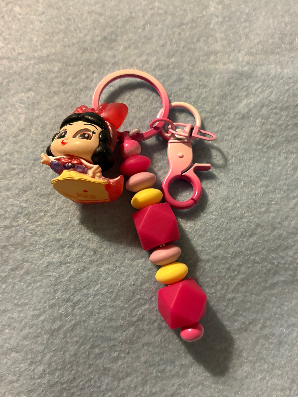 Thumbnail: Snow White character figurine keychain with pink and yellow beads.