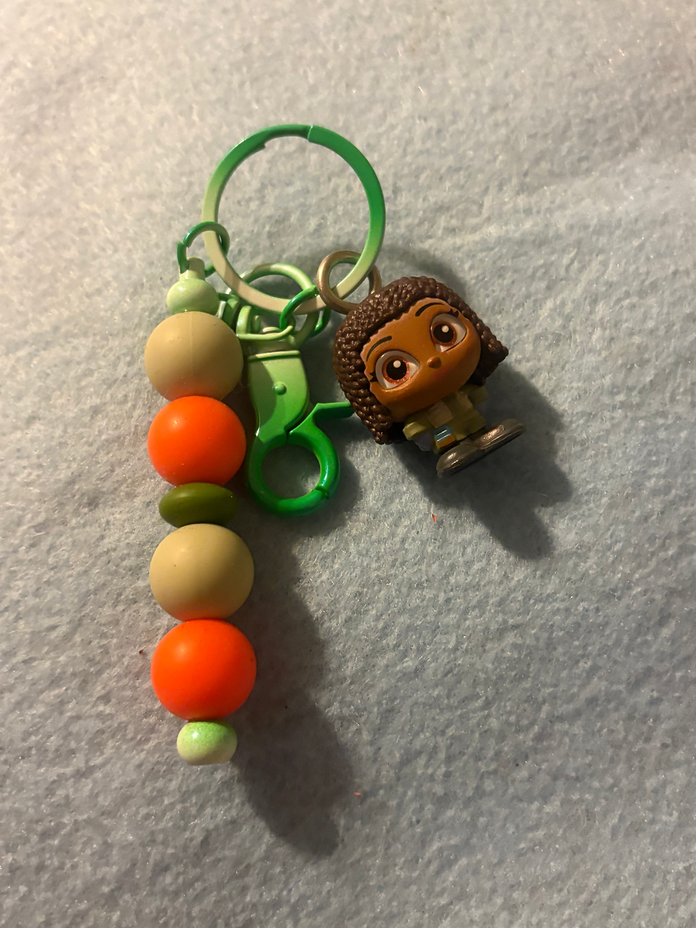 Thumbnail: Moana Funko Pop keychain with colorful beads on a green clip.