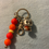 Thumbnail: Keychain with gray bear charm and orange, red, yellow beads.