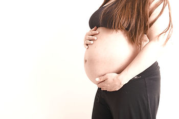 pregnant holding her tummy_edited.jpg