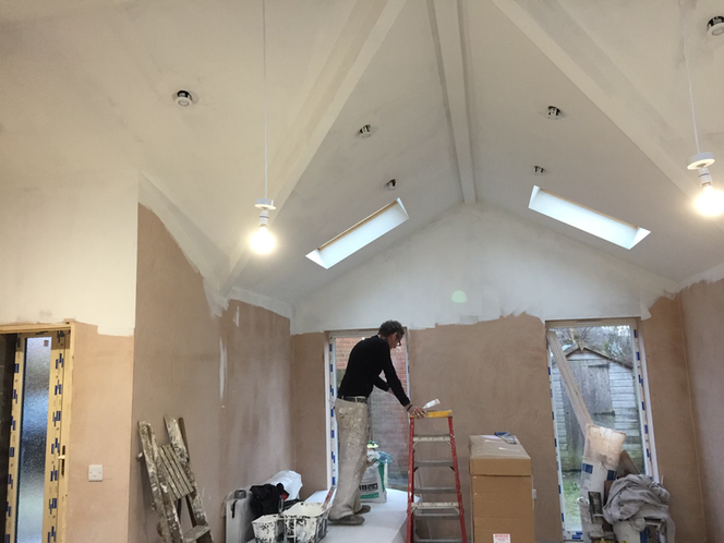 plastered extension being painted white