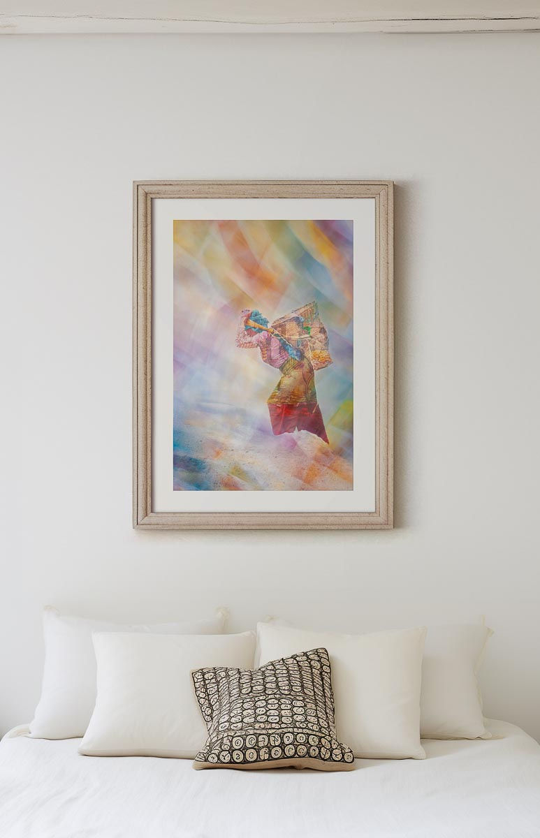 Interior mock up of framed fine art photograph of a nepali woman carrying a large basket seen through a veil of colourful prayer flags.