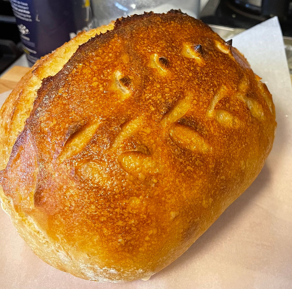 Thumbnail: Artisan loaf of bread with decorative cuts.