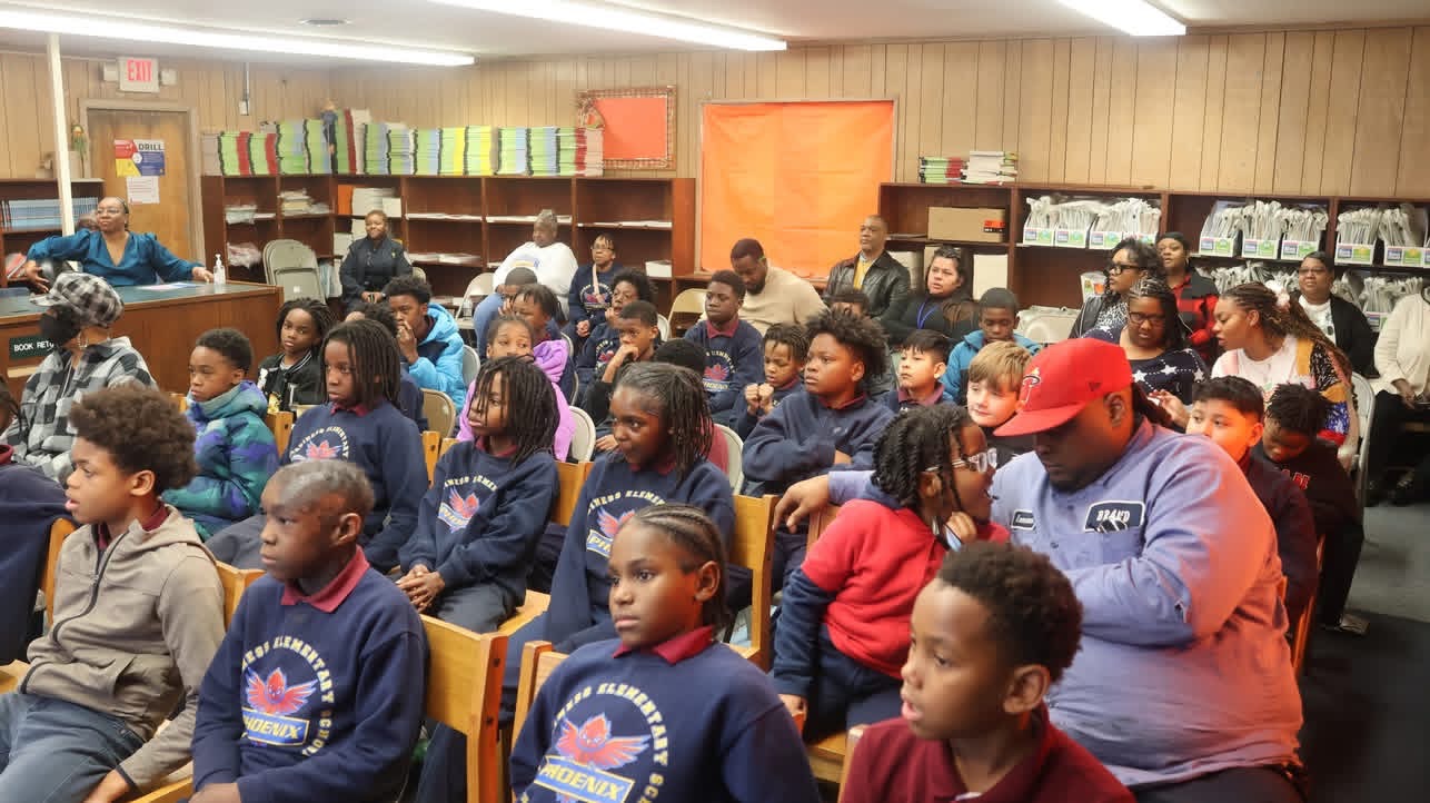 Students and adults gathered for a school community event