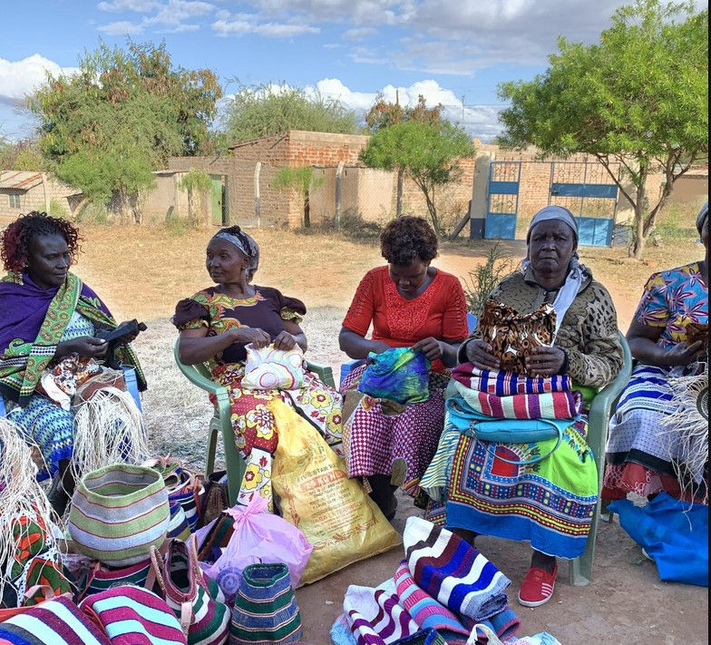 Thumbnail: ladies of Kaross Weavers working on their embroideries