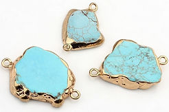 chunks of turquoise framed with gold metal