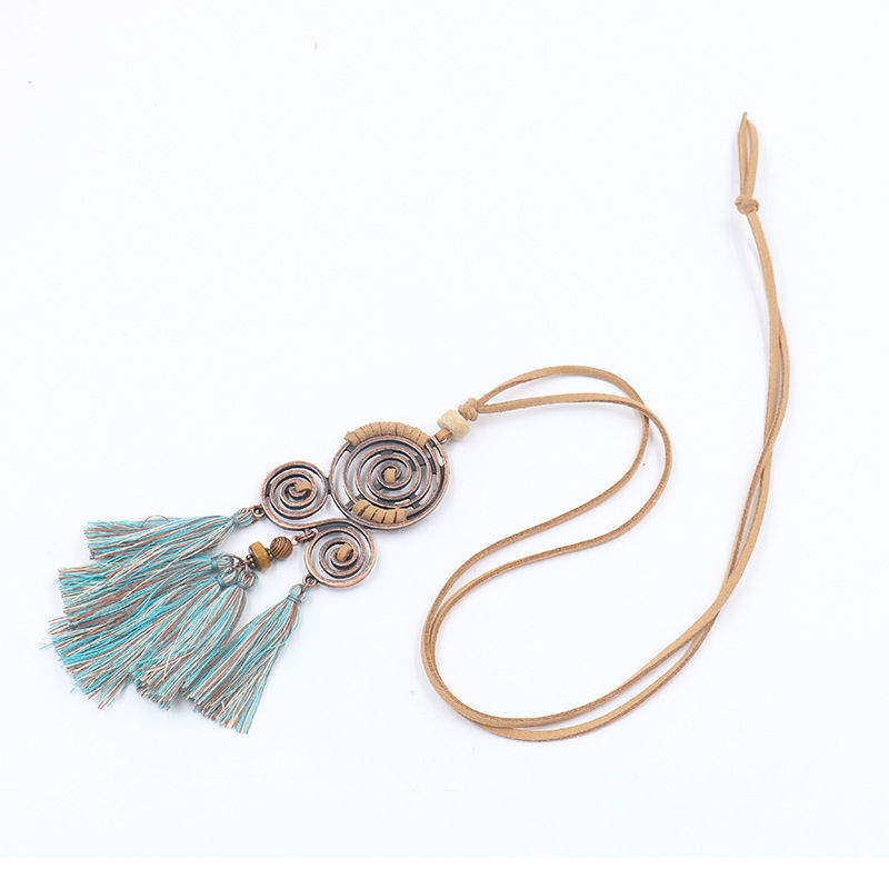 3 bronze spiral pendant necklace with turquoise tassels on leather thong
