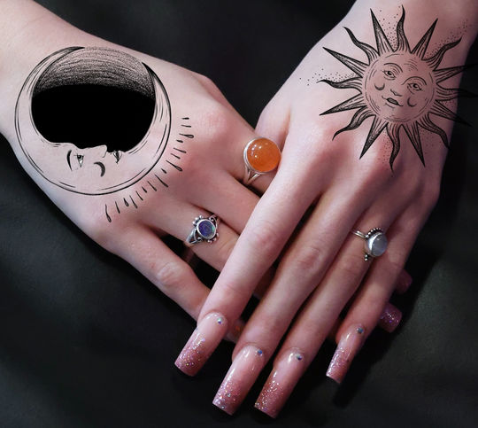 Sun and Moon on hands_edited.jpg