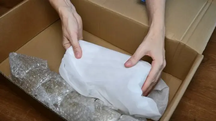 depositphotos_438514726-stock-photo-packing-up-fragile-tableware-into.jpg