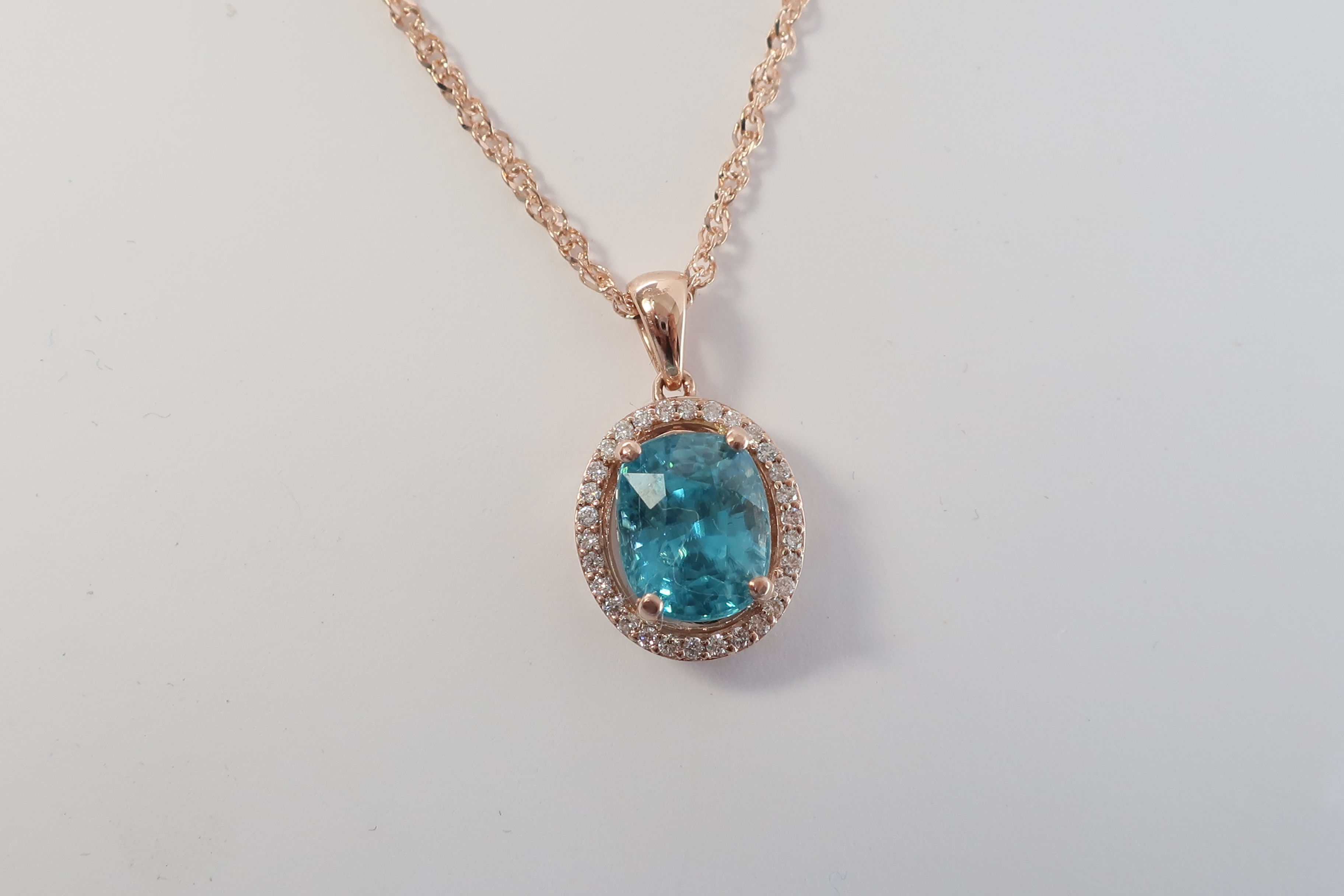 Ladies Halo design Blue Zircon and Diamond Pendent. 5.33ct.tw