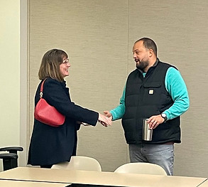 2025, LMV Coffee mike white greeting attendee.jpg