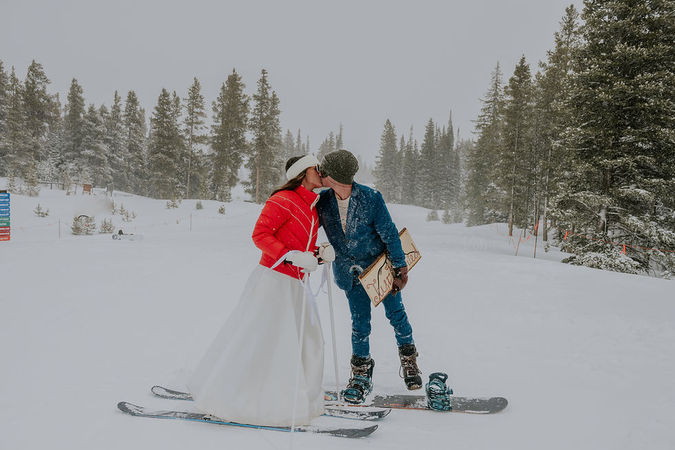 a west wall wedding venue couple kissing after skiing at mount crested butte