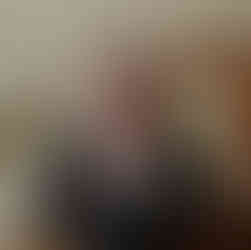 groom adjusting his color as he gets ready for his wedding day