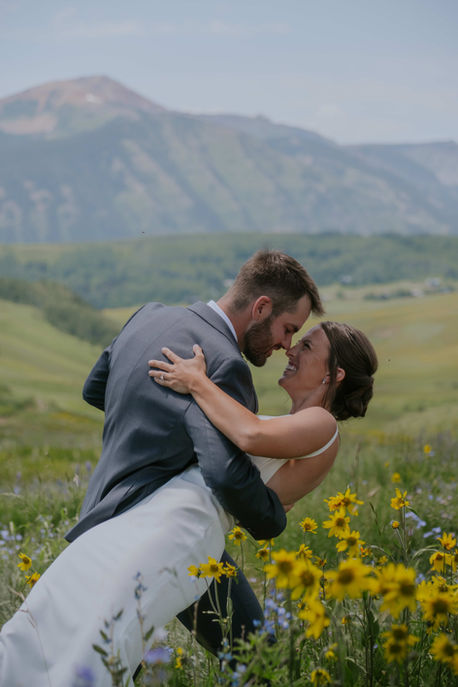 couple getting married in crested butte wildflowers