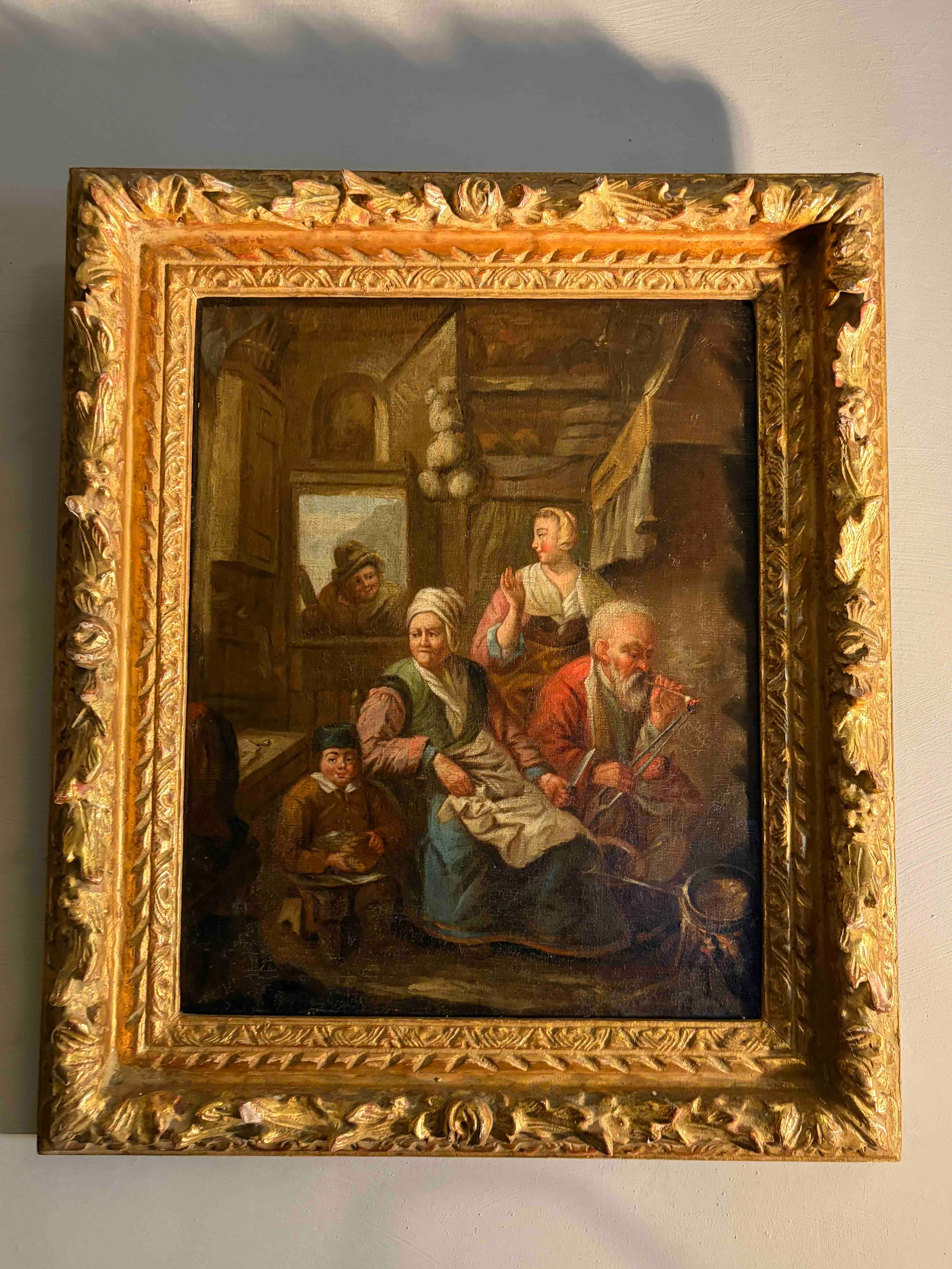 Huile sur toile  "Scène intérieure  d'un paysan  fumant la pipe et sa famille" d