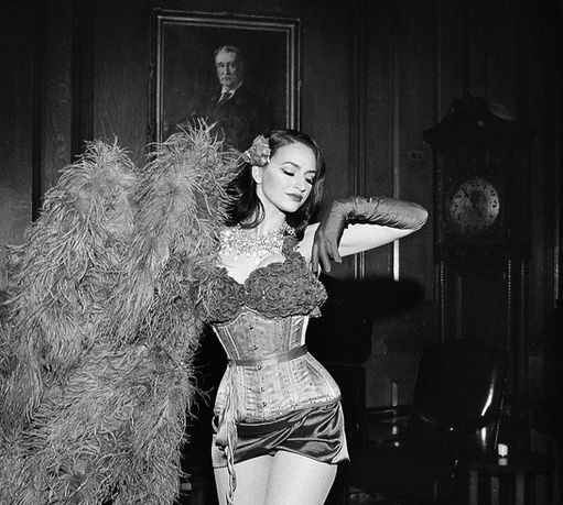 Magnum Opus Productions Hudson Valley Event Entertainment. Feather Flapper girls, Art Deco, speakeasy showgirls. Martina Markota. angel charity gala. red rose costume, corset