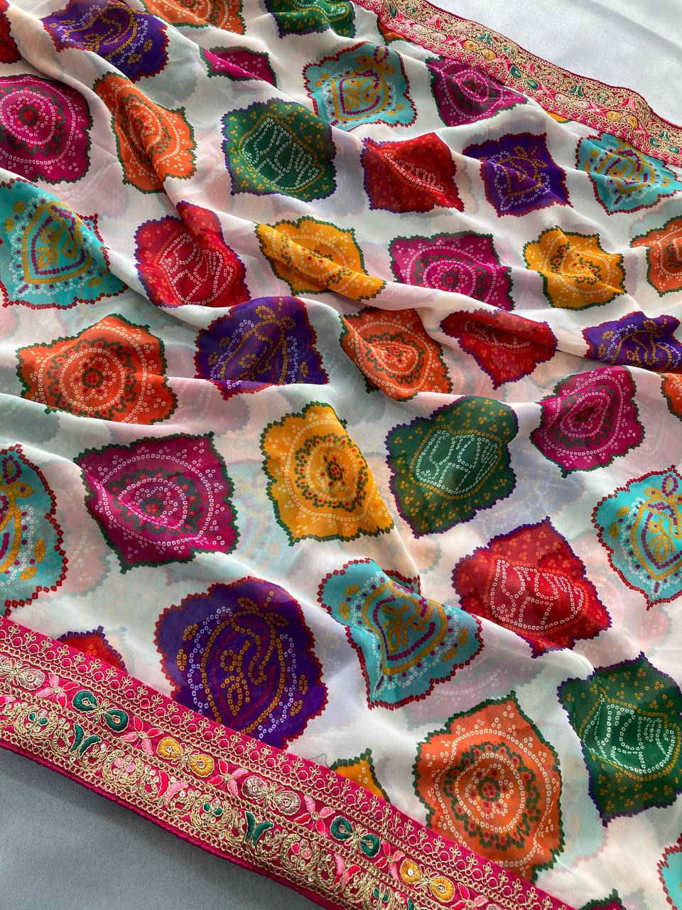 Thumbnail: Women Georgette Bandhej Print Saree with Embroidery Lace Border