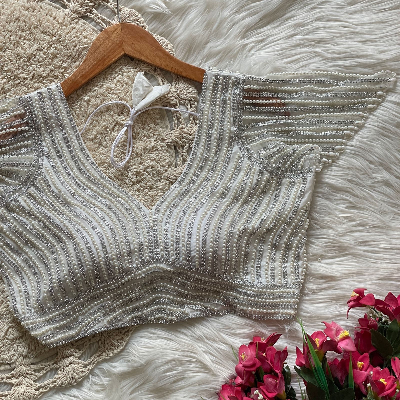 Presenting beautiful handcrafted pearl work in all over front and back of the b