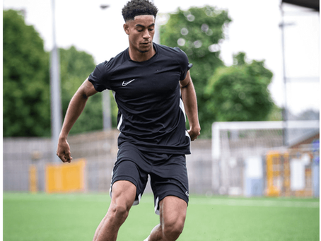 young footballer building confidence during football training session in Ware