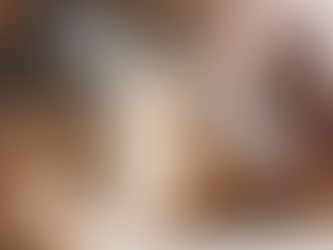 A loaf of bread being sliced by a knife