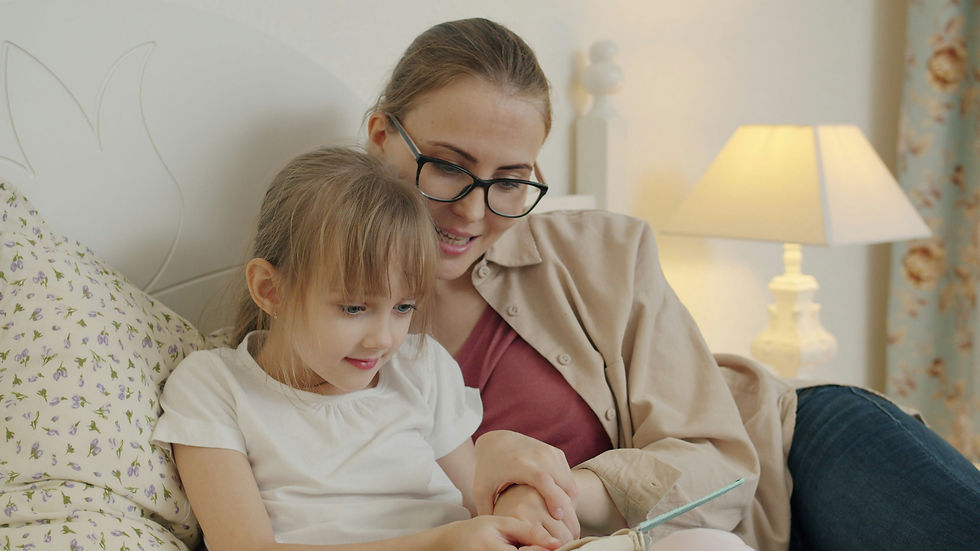 Mom reading to daughter