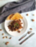 Plated satue mushrooms, white plate on marble table