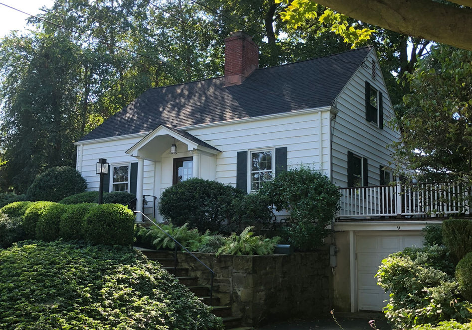 White clapboard house in protected historic district