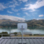 Wireless broadband radio on top of a house roof aiming at the Canterbury High Country in New Zealand