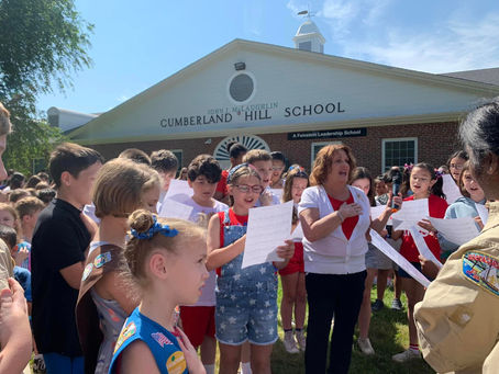 Mia celebrates Flag Day with J.J. McLaughlin students