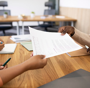 man-holding-contract-his-new-office-job-after-interview_edited.jpg