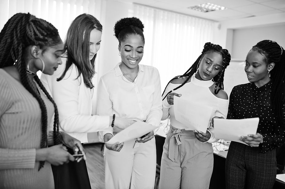 five-multiracial-business-womans-standing-office-with-papers-hands-diverse-group-female-em