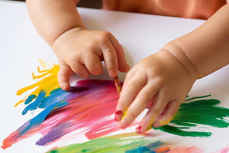 photo of hands of a child painting.jpg