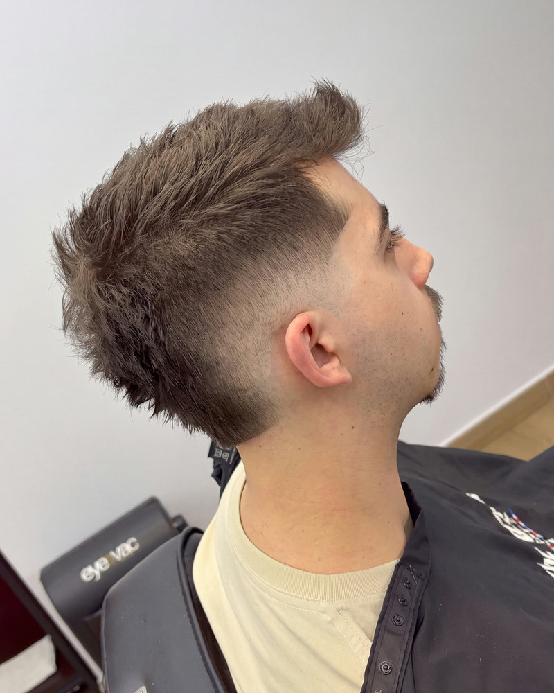 Skin fade side profile cut at The Cave barbershop