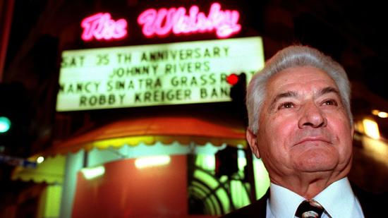 Mario Maglieri, who died Thursday at 93, stands outside the Whisky a Go Go during its 35th anniversary celebration in 1999. (Wally Skalij / Los Angeles Times)