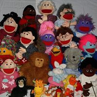 Close-up view of colourful puppets arranged on a stage