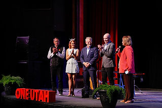 Live keynote and speaker presentations on stage.