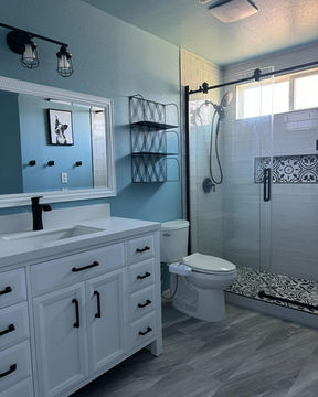 Elegant bathroom renovation featuring tile shower, glass enclosure, and floating vanity in El Dorado Hills, CA by ANCON Design Build